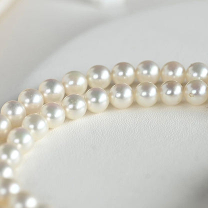 Highest Grade Mikimoto Hanadama Akoya Pearl Necklace with 5.5-6mm round pearls and silver clasp