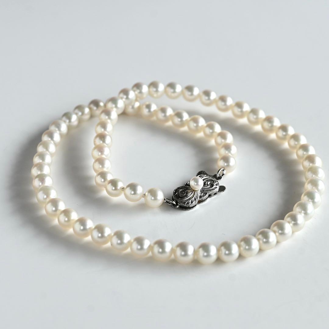 Highest Grade Mikimoto Hanadama Akoya Pearl Necklace with 5.5-6mm round pearls and silver clasp