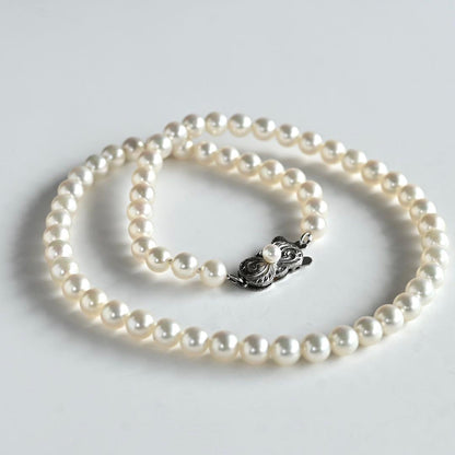 Highest Grade Mikimoto Hanadama Akoya Pearl Necklace with 5.5-6mm round pearls and silver clasp