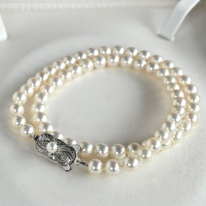 Highest Grade Mikimoto Hanadama Akoya Pearl Necklace with 5.5-6mm round pearls and silver clasp