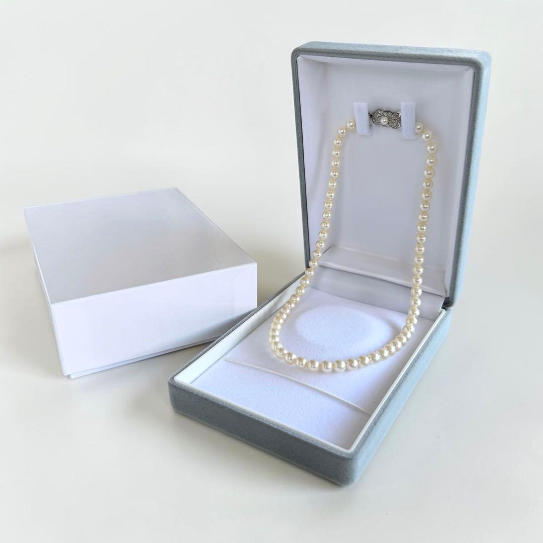 Highest Grade Mikimoto Hanadama Akoya Pearl Necklace with 5.5-6mm round pearls and silver clasp