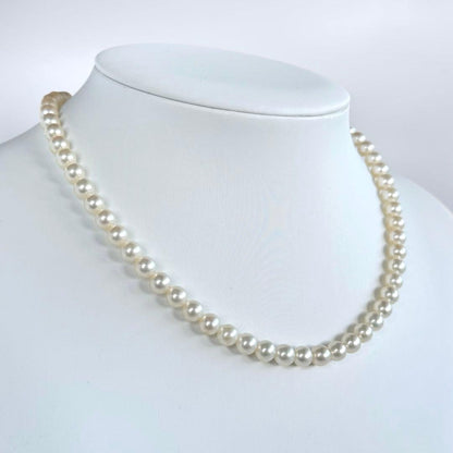 Highest Grade Mikimoto Hanadama Akoya Pearl Necklace with 5.5-6mm round pearls and silver clasp
