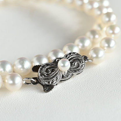 Highest Grade Mikimoto Hanadama Akoya Pearl Necklace with 5.5-6mm round pearls and silver clasp
