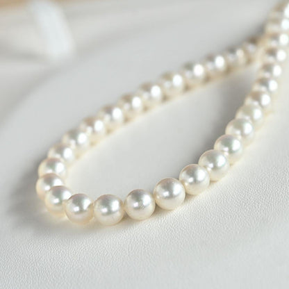 Highest Grade Mikimoto Hanadama Akoya Pearl Necklace with 5.5-6mm round pearls and silver clasp