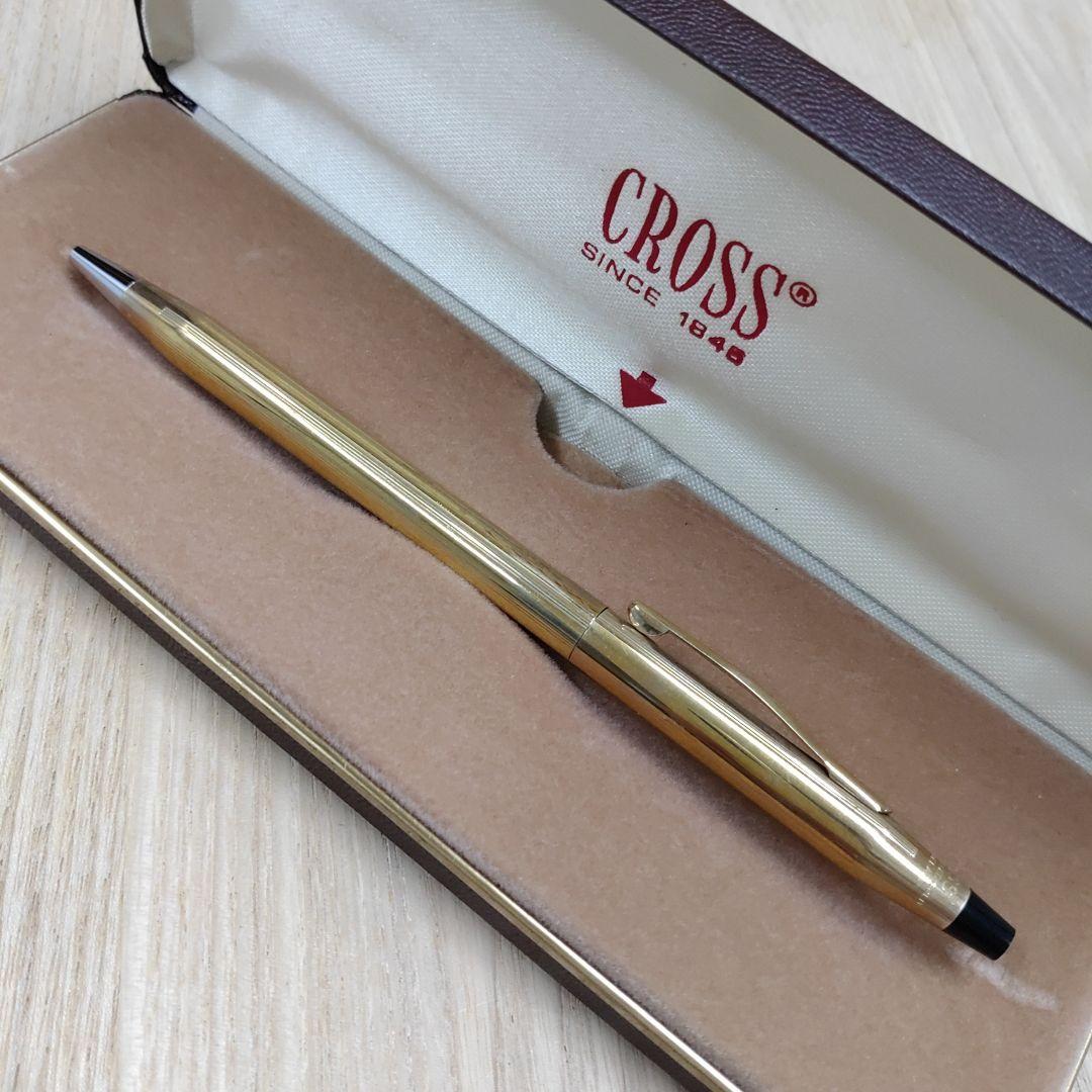 Cross gold ballpoint pen made of metal displayed with its protective case