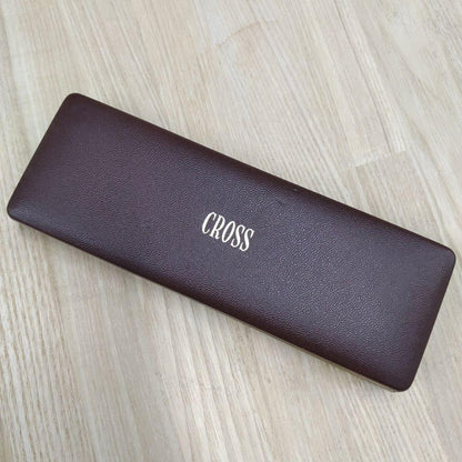 Cross gold ballpoint pen made of metal displayed with its protective case