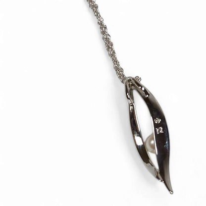 Tasaki Tahashi pearl pendant necklace featuring a 4.5 mm freshwater pearl on a 42 cm silver chain