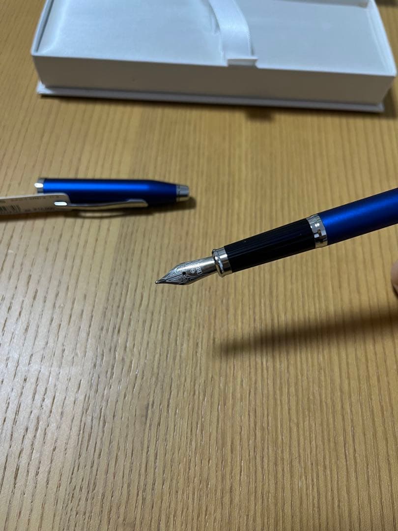 Unused CROSS blue fountain pen with fountain pen tip and slightly dirty box shown in third photo