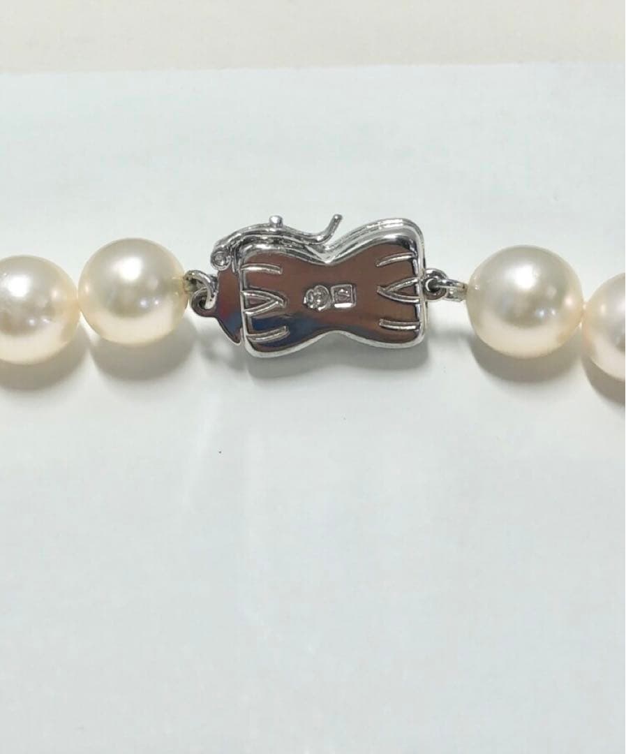 Tasaki Akoya pearl necklace and matching earrings set with 7.5mm pearls and silver double lock clasp