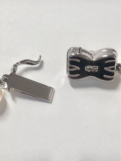 Tasaki Akoya pearl necklace and matching earrings set with 7.5mm pearls and silver double lock clasp