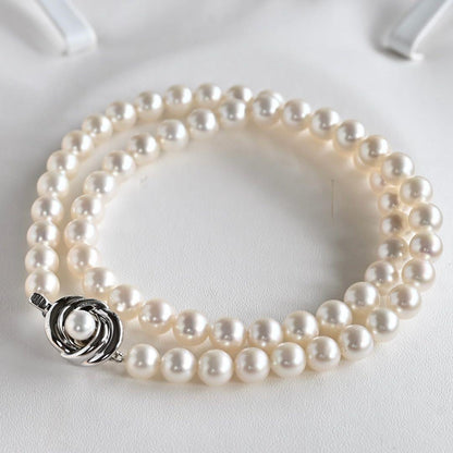 Takatsuki pearl necklace and matching earrings set with round 7mm Aoyama pearls and silver clasps
