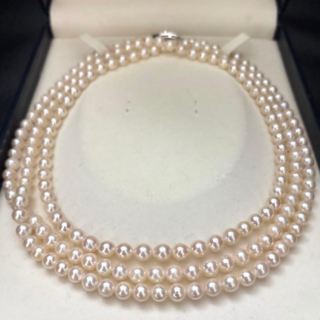 Long 125cm three-strand Akoya pearl necklace with 6.5mm pearls displayed on white background