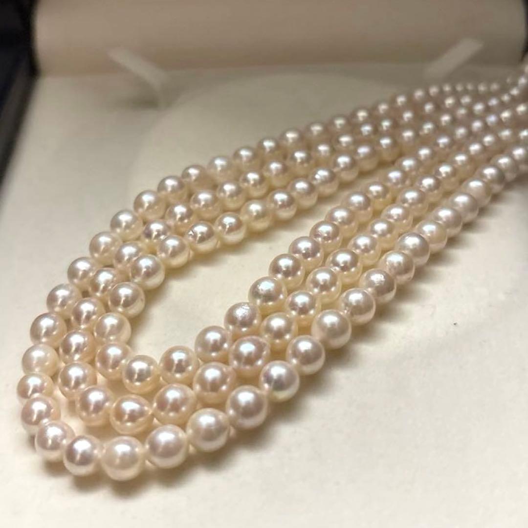 Long 125cm three-strand Akoya pearl necklace with 6.5mm pearls displayed on white background