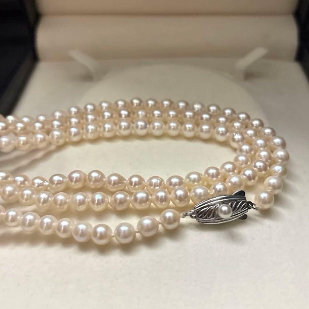 Long 125cm three-strand Akoya pearl necklace with 6.5mm pearls displayed on white background