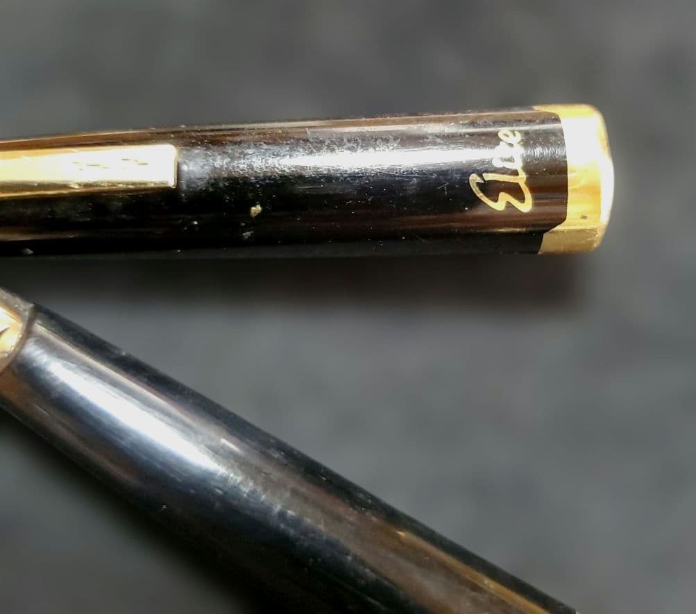 Black Pilot Elite fountain pen with resin body and gold plated accents shown with 14K586 nib