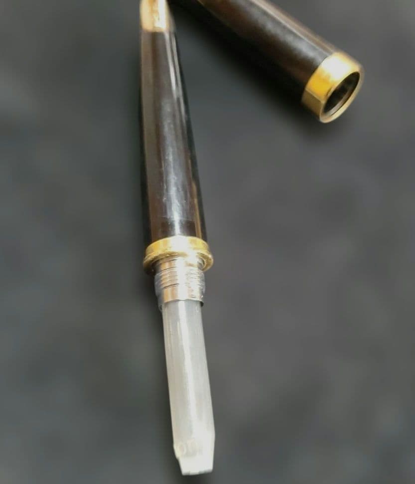 Black Pilot Elite fountain pen with resin body and gold plated accents shown with 14K586 nib