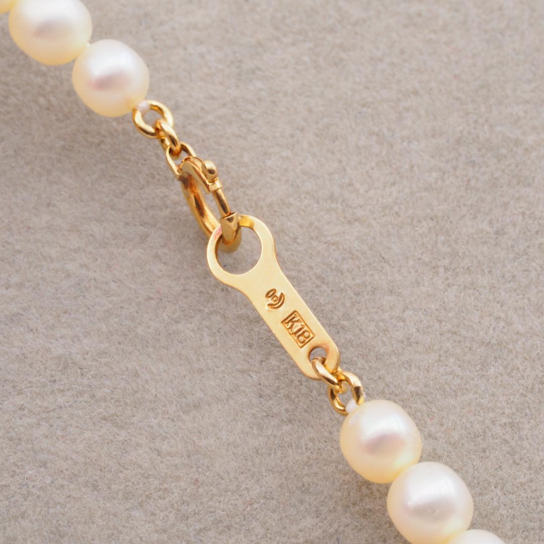 Tasaki necklace featuring 4.5-5.0mm freshwater pearls set on 18K yellow gold chain length 42cm