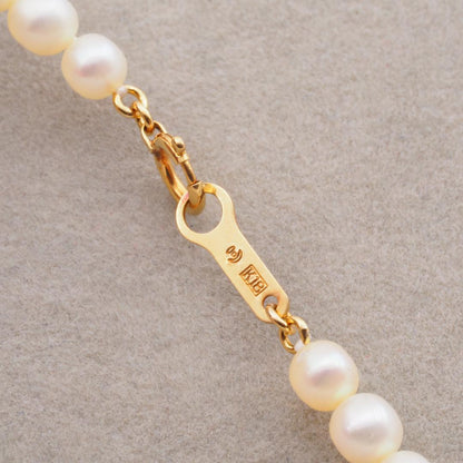 Tasaki necklace featuring 4.5-5.0mm freshwater pearls set on 18K yellow gold chain length 42cm