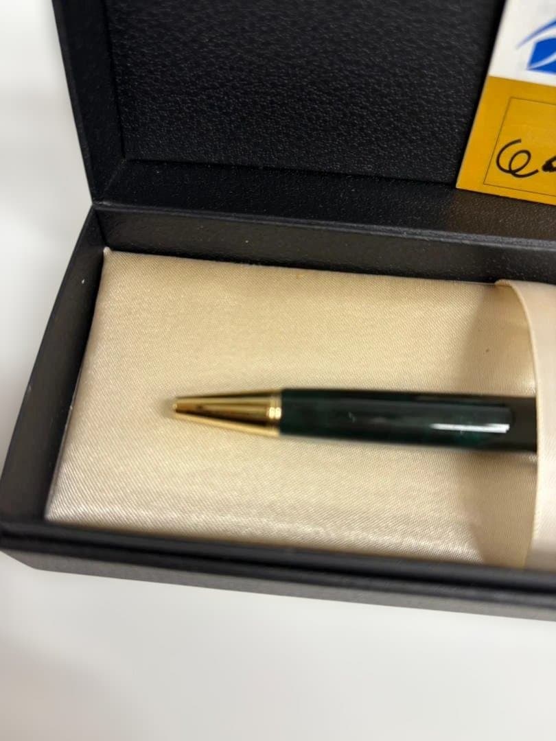 KWPILOT green ballpoint pen body with gold accents and oil-based ink