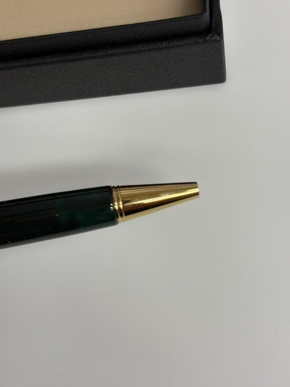 KWPILOT green ballpoint pen body with gold accents and oil-based ink