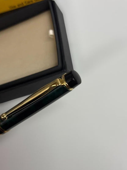 KWPILOT green ballpoint pen body with gold accents and oil-based ink