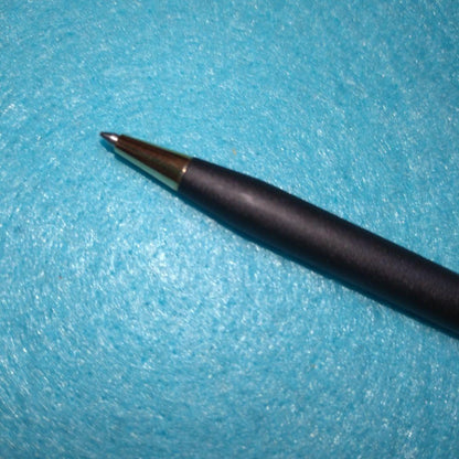 Cross ballpoint pen with black ink refill shown on white background