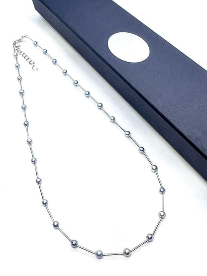 Akoya Pearl Indigo Blue Baby Pearl Station Necklace with silver parts and alloy clasp on white background