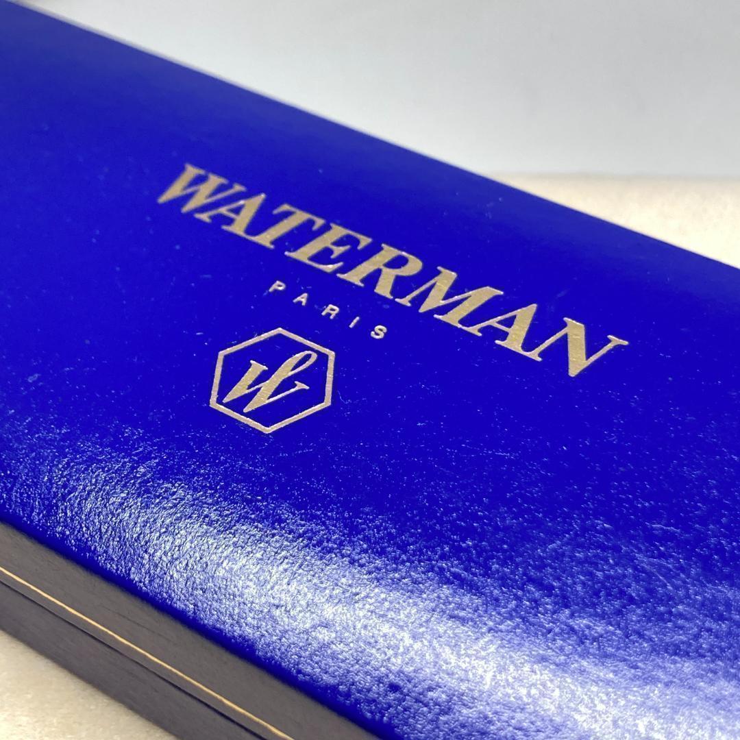 Waterman ballpoint pen with silver metal body, twist mechanism, black ink, and matching silver case