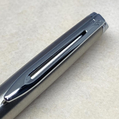Waterman ballpoint pen with silver metal body, twist mechanism, black ink, and matching silver case