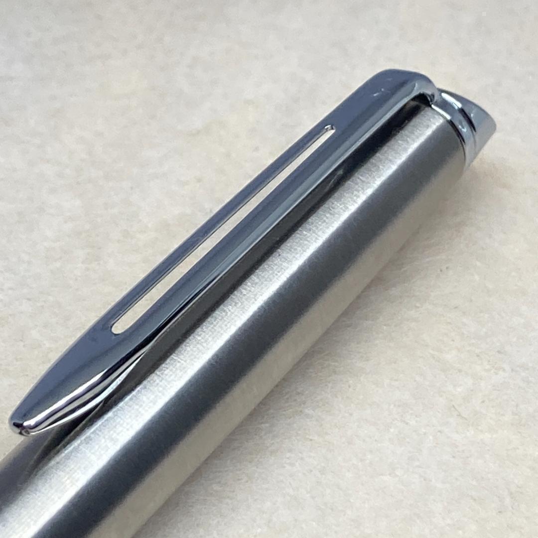 Waterman ballpoint pen with silver metal body, twist mechanism, black ink, and matching silver case