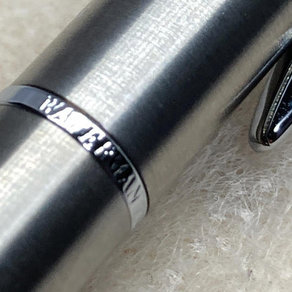 Waterman ballpoint pen with silver metal body, twist mechanism, black ink, and matching silver case