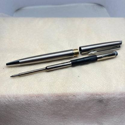 Waterman ballpoint pen with silver metal body, twist mechanism, black ink, and matching silver case