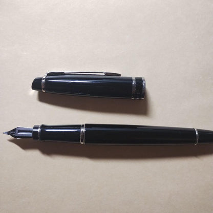 WATERMAN Expert Black Fountain Pen made of black resin with silver accents, shown capped