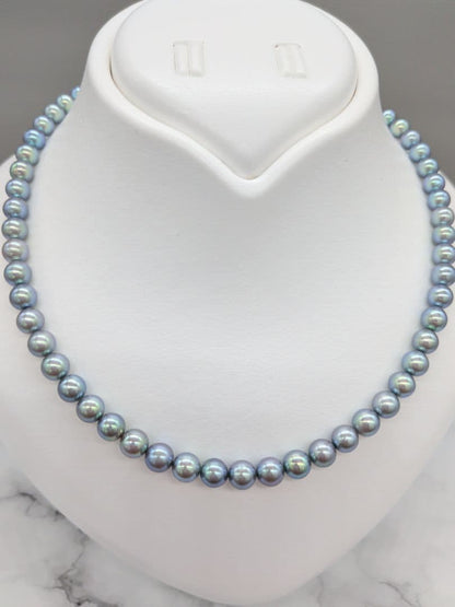 Akoya black pearl necklace featuring 7mm light peacock South Sea pearls with silver clasp, 42.3 cm length