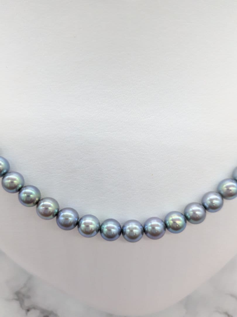 Akoya black pearl necklace featuring 7mm light peacock South Sea pearls with silver clasp, 42.3 cm length