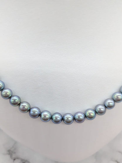 Akoya black pearl necklace featuring 7mm light peacock South Sea pearls with silver clasp, 42.3 cm length