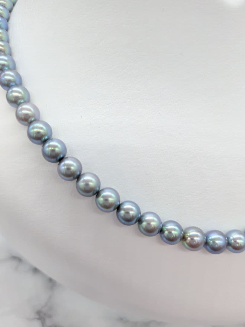 Akoya black pearl necklace featuring 7mm light peacock South Sea pearls with silver clasp, 42.3 cm length