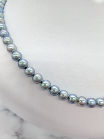 Akoya black pearl necklace featuring 7mm light peacock South Sea pearls with silver clasp, 42.3 cm length