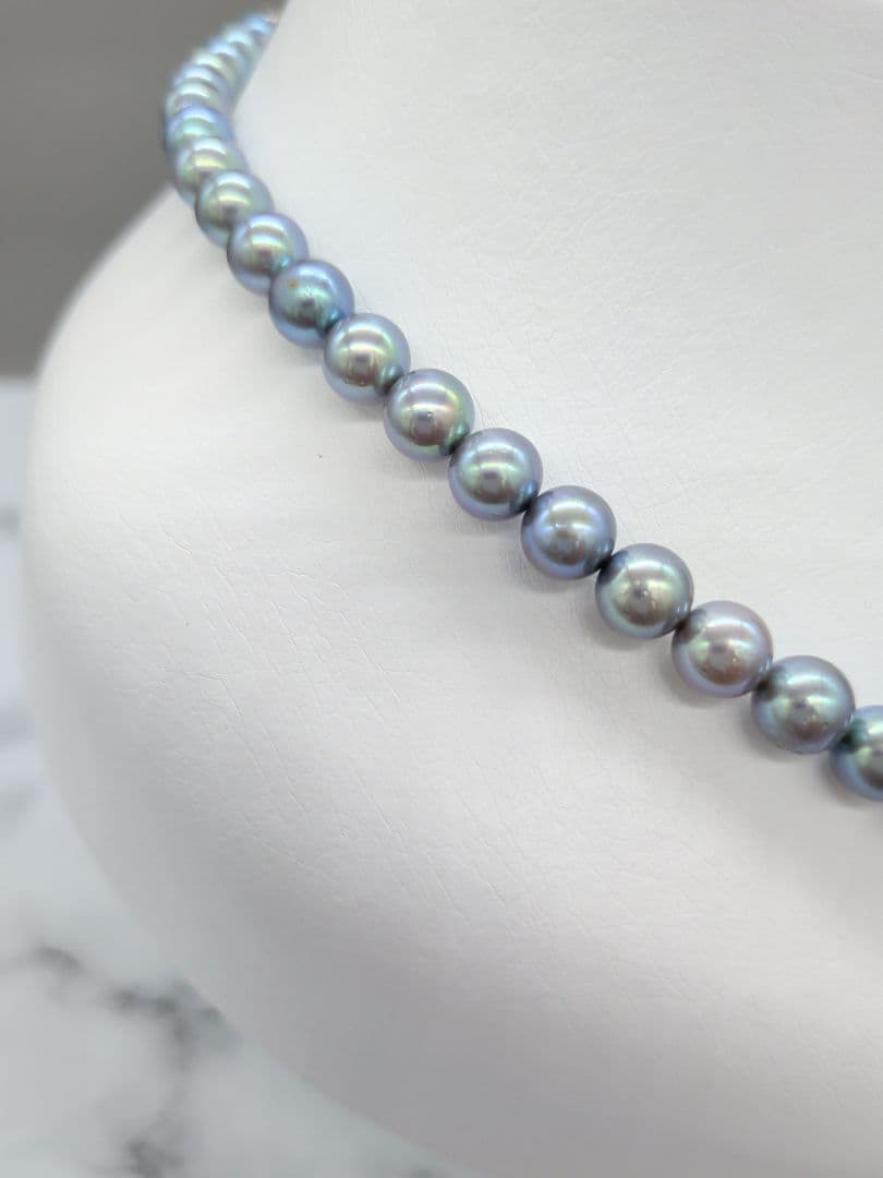 Akoya black pearl necklace featuring 7mm light peacock South Sea pearls with silver clasp, 42.3 cm length