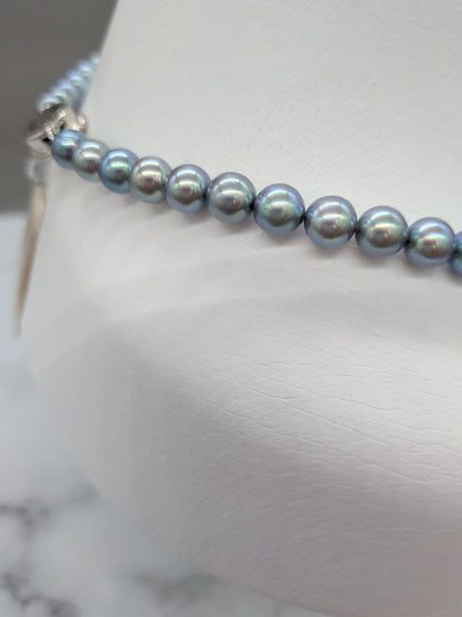 Akoya black pearl necklace featuring 7mm light peacock South Sea pearls with silver clasp, 42.3 cm length