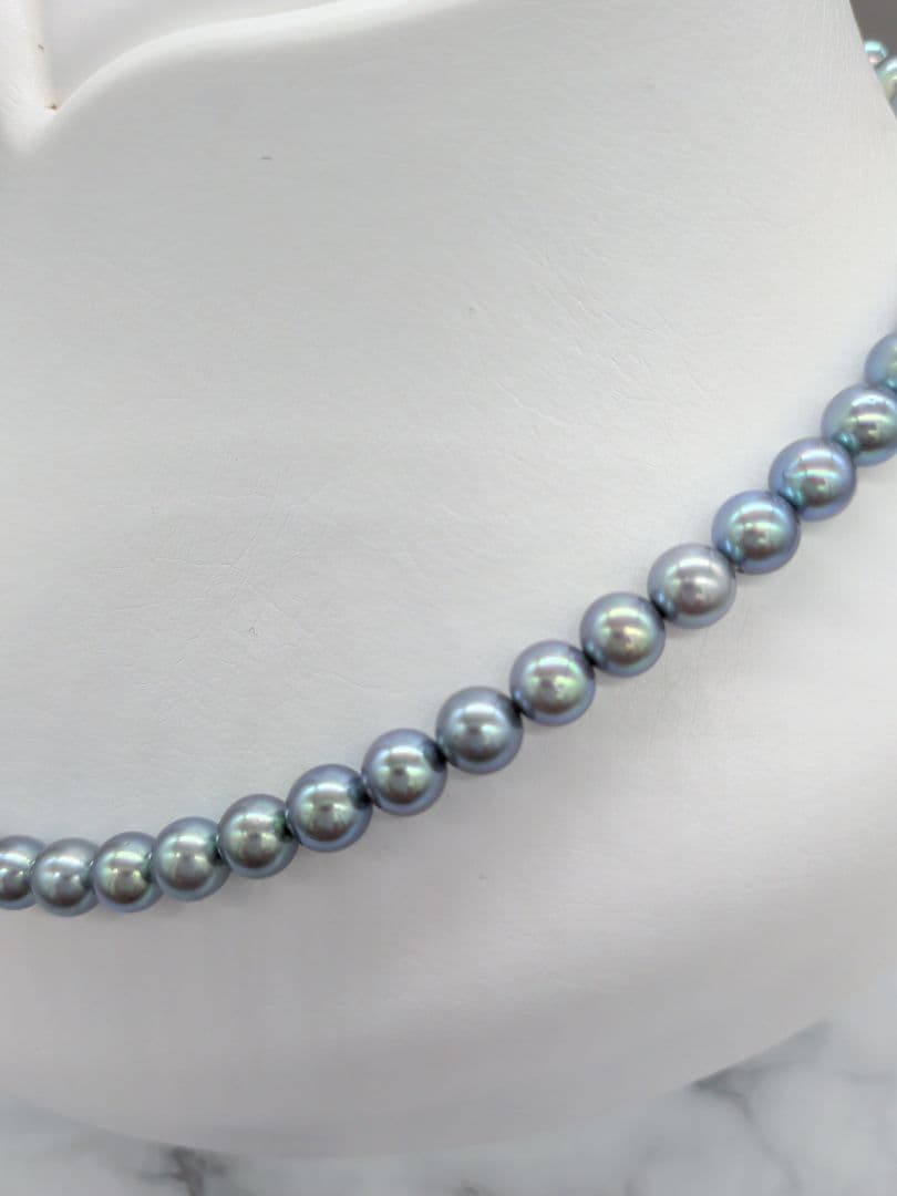 Akoya black pearl necklace featuring 7mm light peacock South Sea pearls with silver clasp, 42.3 cm length