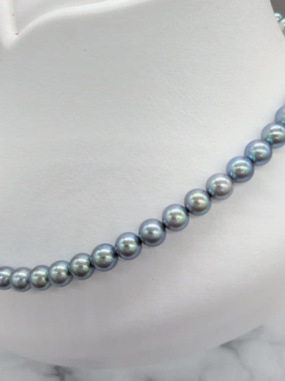 Akoya black pearl necklace featuring 7mm light peacock South Sea pearls with silver clasp, 42.3 cm length
