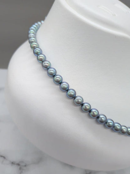 Akoya black pearl necklace featuring 7mm light peacock South Sea pearls with silver clasp, 42.3 cm length