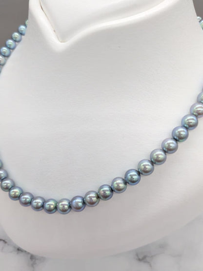 Akoya black pearl necklace featuring 7mm light peacock South Sea pearls with silver clasp, 42.3 cm length