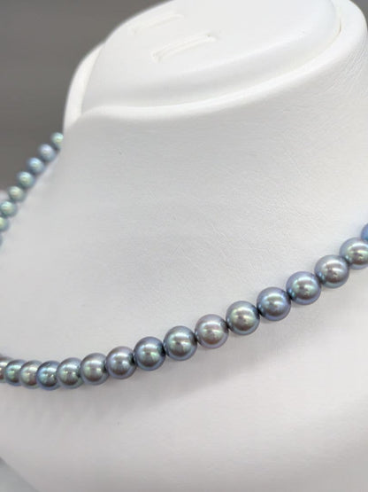 Akoya black pearl necklace featuring 7mm light peacock South Sea pearls with silver clasp, 42.3 cm length