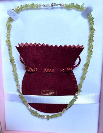 Pink Aurora Akoya Pearl necklace featuring 7 baby pearls and peridot stones with silver clasp