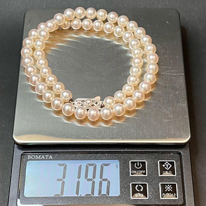 MIKIMOTO K14WG pearl necklace with 7.1 to 7.5mm pearls measuring about 41 inches with a K14WG clasp marked M