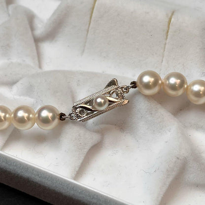 MIKIMOTO K14WG pearl necklace with 7.1 to 7.5mm pearls measuring about 41 inches with a K14WG clasp marked M