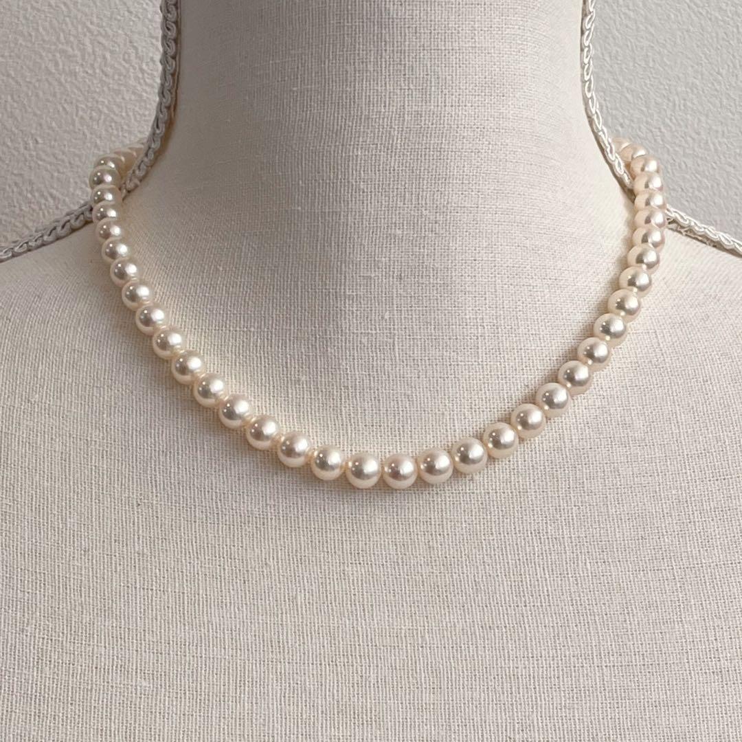 MIKIMOTO K14WG pearl necklace with 7.1 to 7.5mm pearls measuring about 41 inches with a K14WG clasp marked M