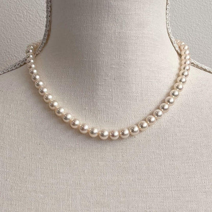 MIKIMOTO K14WG pearl necklace with 7.1 to 7.5mm pearls measuring about 41 inches with a K14WG clasp marked M